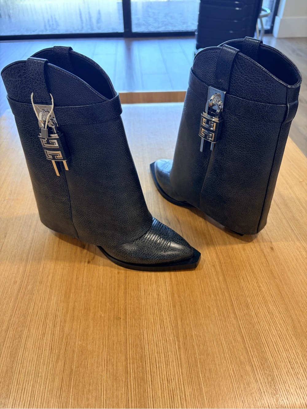 Givenchy aged leather shark lock cowboy ankle boots